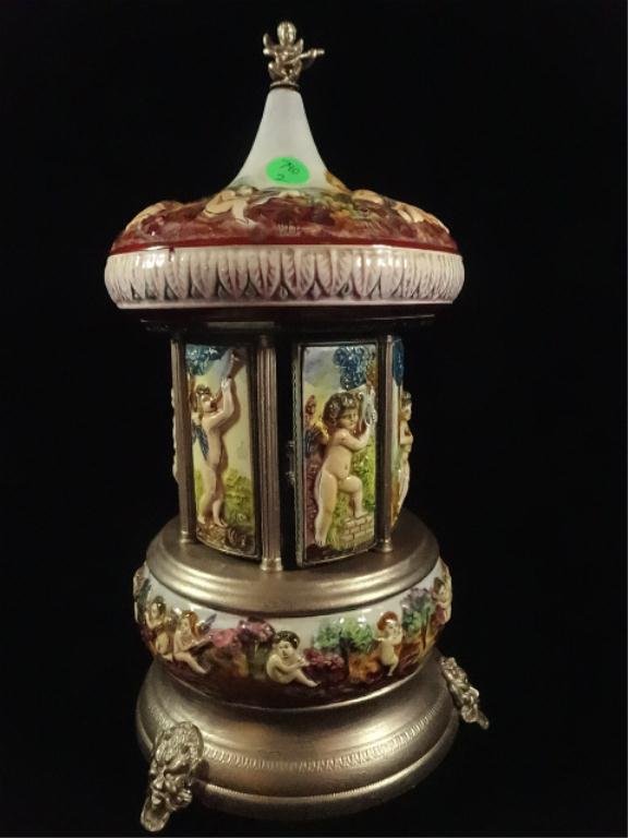 REUGE CAROSEL CAPODIMONTE STYLE MUSIC BOX: REUGE CAROSEL CAPODIMONTE STYLE MUSIC BOX CIGARETTE/LIPSTICK HOLDER, MADE IN ITALY, PLAYS "LOVE STORY", APPROX 13.5"H, SKU790.02
