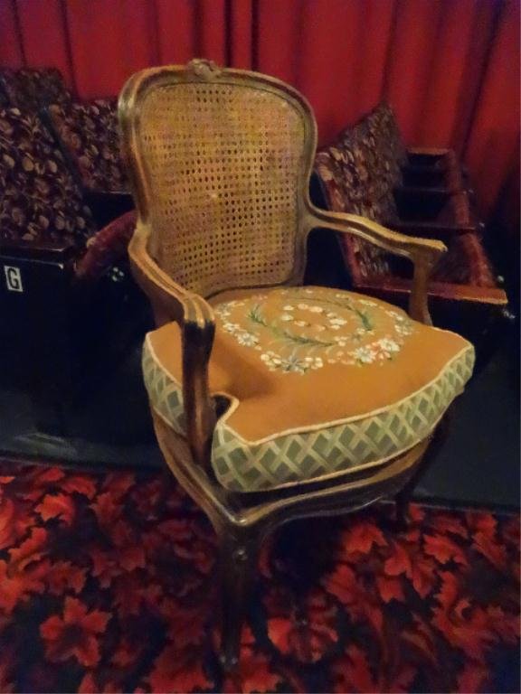 ANTIQUE LOUIS XV STYLE CANE BACK ARMCHAIR, EMBROIDERED: ANTIQUE LOUIS XV STYLE CANE BACK ARMCHAIR, EMBROIDERED SEAT, VERY GOOD VINTAGE CONDITION, ONE SMALL AREA OF BROKEN CANE APPROX 1"