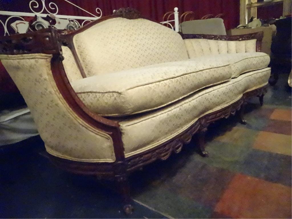 ANTIQUE SOFA, CARVED WOOD FRAME, CHANNEL BACK ARMS,: ANTIQUE SOFA, CARVED WOOD FRAME, CHANNEL BACK ARMS, OVERALL SOLID VINTAGE CONDITION, SOME SURFACE WEAR AND LIGHT STAINS, ONE FOOT DAMAGED, SKU817.1