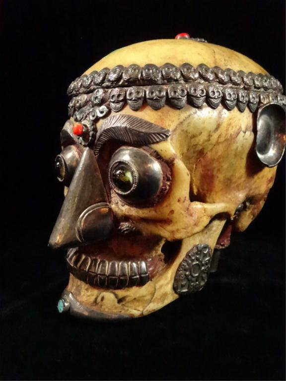 ANTIQUE TIBETAN KAPALA SACRED HUMAN SKULL, DECORATED IN: ANTIQUE TIBETAN KAPALA SACRED HUMAN SKULL, DECORATED IN SEMI-PRECIOUS STONE & GLASS WITH REPOUSSE METALWORK, HINGED HUMAN SKULL CAP, USED IN TANTRIC HIMALAYAN BUDDHIST SACRED RITUALS, APPROX 7.5"H