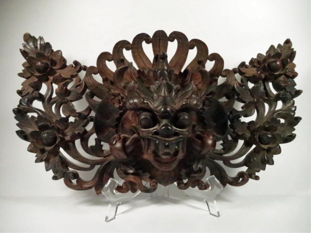 BALINESE CARVED WOODEN MASK, WITH REPAIR TO UPPER LEFT,: BALINESE CARVED WOODEN MASK, WITH REPAIR TO UPPER LEFT, ELABORATE APRON, APPROX 17" X 10", SKU895
