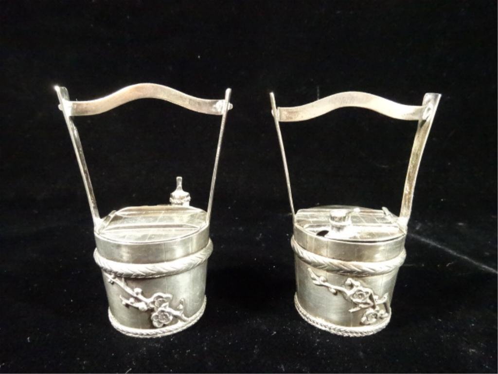 TWO STERLING SILVER SALT CELLARS, IN THE FORM OF A: TWO STERLING SILVER SALT CELLARS, IN THE FORM OF A COVERED WELL, WEIGHS APPROX 54 GRAMS, APPROX 3"H, SKU888.07