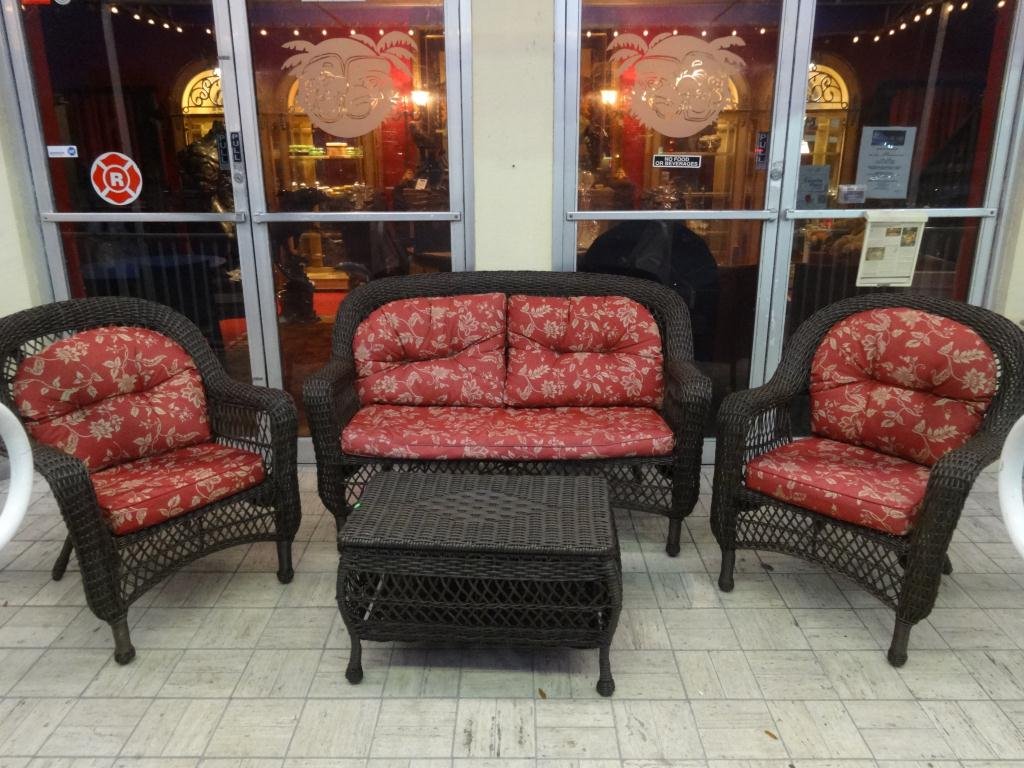 4 PC ALL WEATHER PATIO SET, INCLUDES LOVESEAT, 2: 4 PC ALL WEATHER PATIO SET, INCLUDES LOVESEAT, 2 ARMCHAIRS, AND TABLE WITH STORAGE, RED AND GOLD CUSHIONS, LIKE NEW CONDITION, SKU963.07