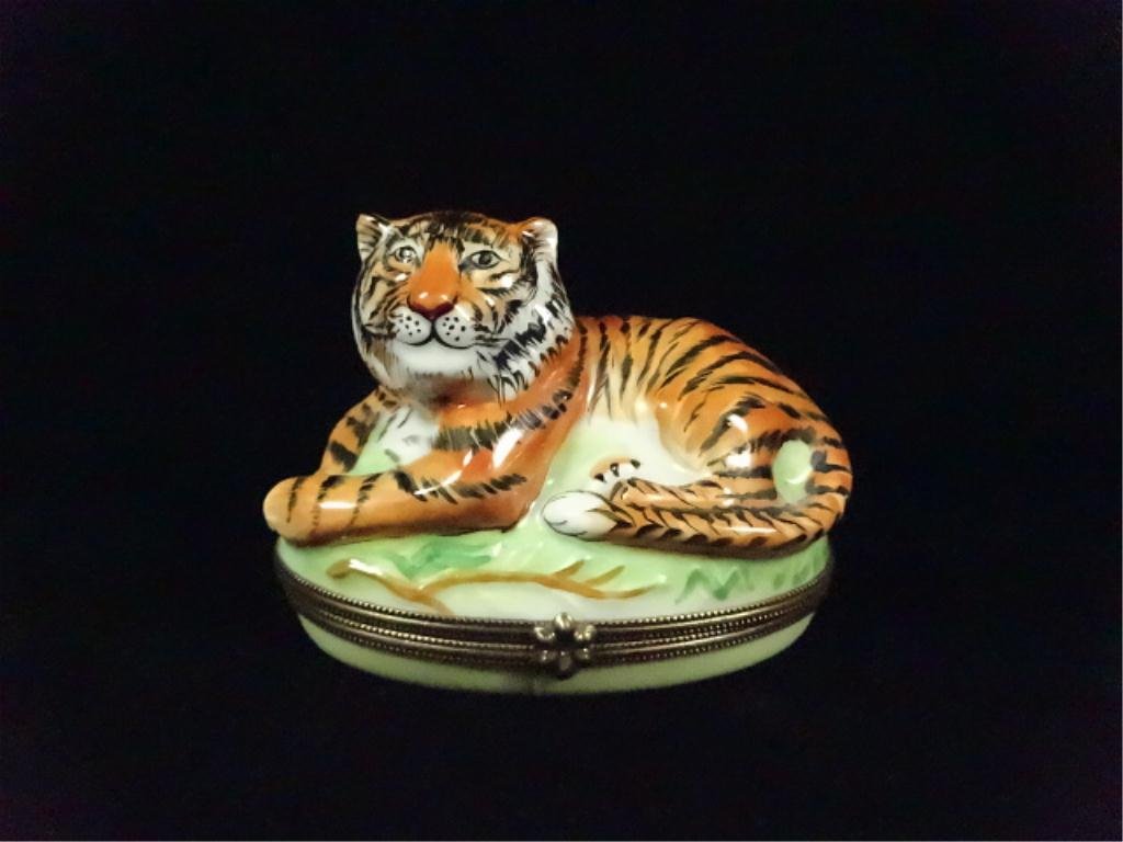 LIMOGES PORCELAIN BOX IN THE FORM OF A TIGER,: LIMOGES PORCELAIN BOX IN THE FORM OF A TIGER, HANDPAINTED IN FRANCE, APPROX 2 5/8" X 3 1/2" X 2 1/4"