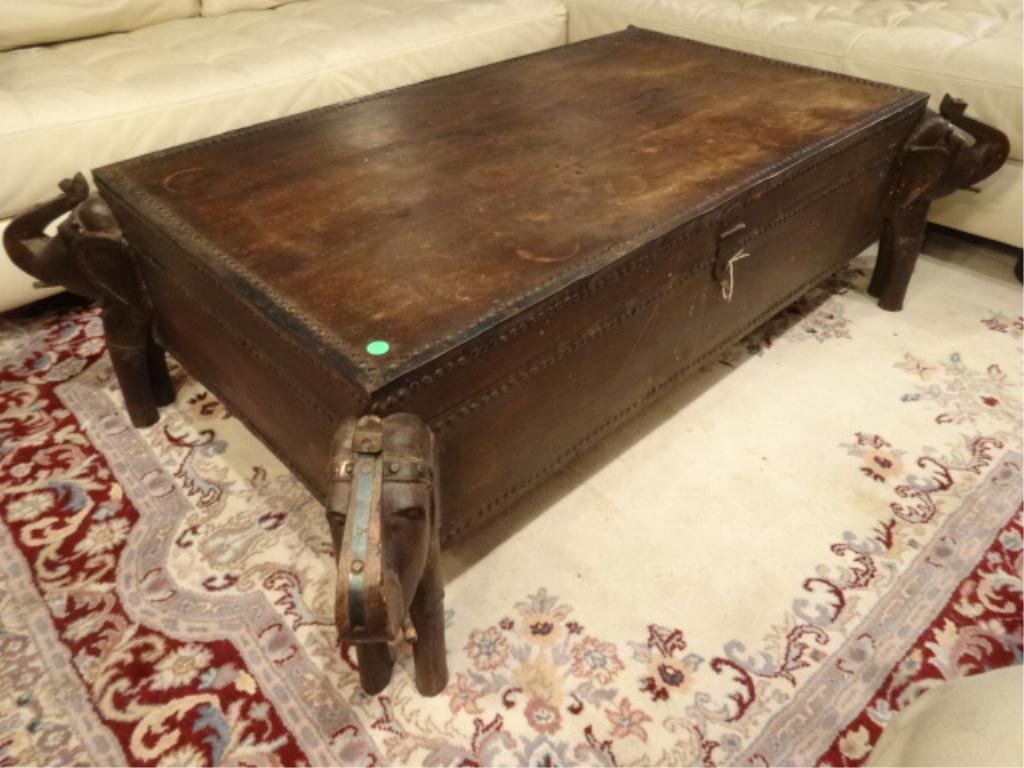 WOOD CHEST / COFFEE TABLE, ELEPHANT FORM LEGS, NAILHEAD: WOOD CHEST / COFFEE TABLE, ELEPHANT FORM LEGS, NAILHEAD TRIM, SOLID VINTAGE CONDITION, SOME LIGHT SURFACE DISCOLORATION ON TOP, APPROX 4'W