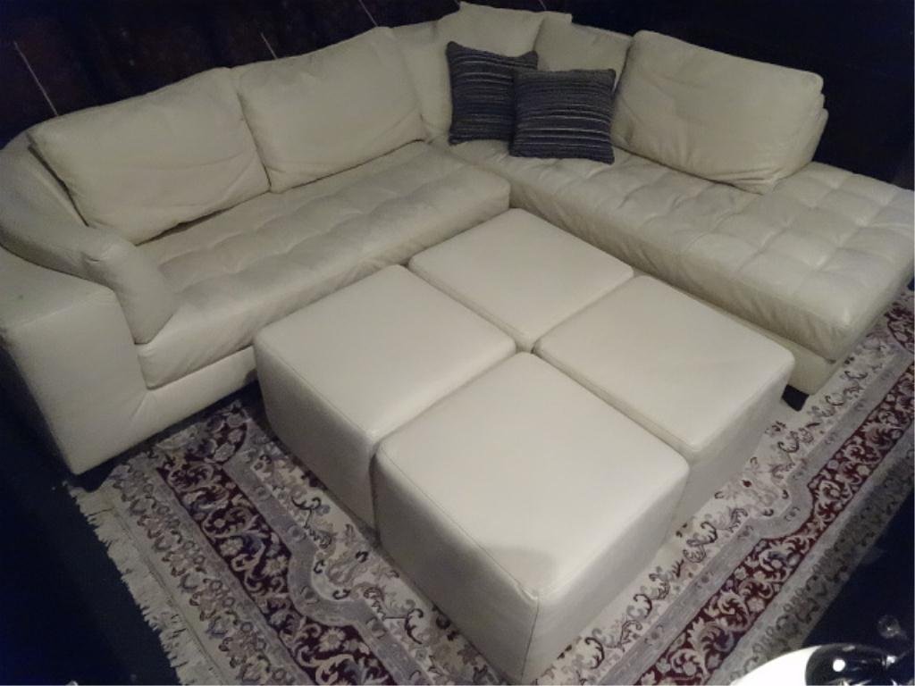 NATUZZI 2 PC IVORY LEATHER SECTIONAL SOFA, TUFTED: NATUZZI 2 PC IVORY LEATHER SECTIONAL SOFA, TUFTED SEATS, DOWN FILLED CUSHIONS, WITH OPTIONAL REMOVABLE CORNER WOOD TABLE TOPS, MATCHING OTTOMANS SOLD SEPARATELY THIS AUCTION, SKU983.01