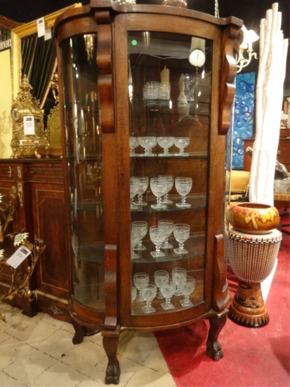 ANTIQUE OAK VITRINE CABINET, CURVED FRONT, SINGLE DOOR,: ANTIQUE OAK VITRINE CABINET, CURVED FRONT, SINGLE DOOR, GLASS SHELVES, HOOF FEET, APPROX 6'H, SKU025.04
