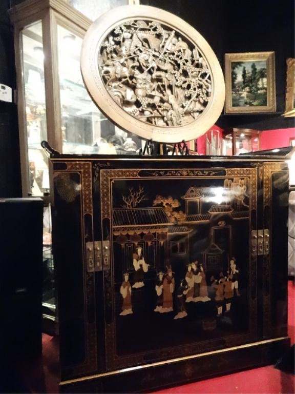 CHINOISERIE BAR CABINET, BLACK LACQUER WITH PAINTED: CHINOISERIE BAR CABINET, BLACK LACQUER WITH PAINTED FIGURES AND PAVILIONS, REVOLVING CENTER CABINET HAS BOTTLE AND GLASS RACKS, FLANKED BY TWIN SIDE CABINETS, APPROX 4'W X 4'H, H25