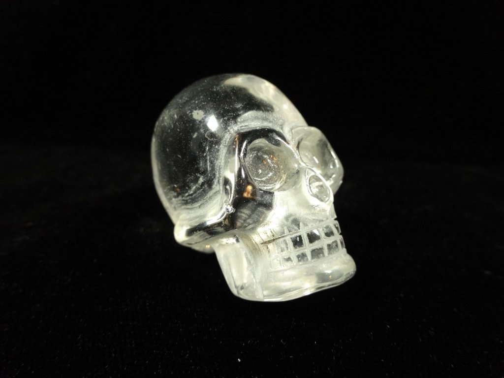 SMALL CARVED CRYSTAL SKULL, APPROX 1.5"H: SMALL CARVED CRYSTAL SKULL, APPROX 1.5"H