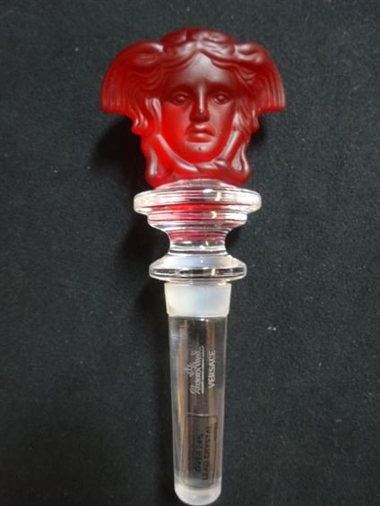 ROSENTHAL VERSACE MEDUSA CRYSTAL WINE STOPPER, RED,: ROSENTHAL VERSACE MEDUSA CRYSTAL WINE STOPPER, RED, WITH ORIGINAL BOX, MARKED, APPROX 5", PREVIEW AT OUR 2400 E. OAKLAND PARK BLVD SHOWROOM, FT. LAUDERDALE