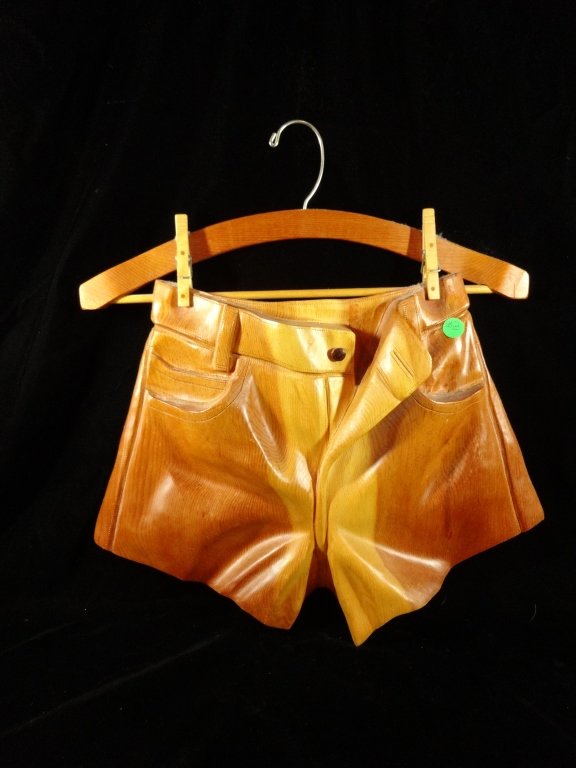 CARVED WOODEN SCULPTURE, SHORTS ON HANGER, SIGNED BY: CARVED WOODEN SCULPTURE, SHORTS ON HANGER, SIGNED BY ARTIST & DATED 1996, APPROX 18.5"H