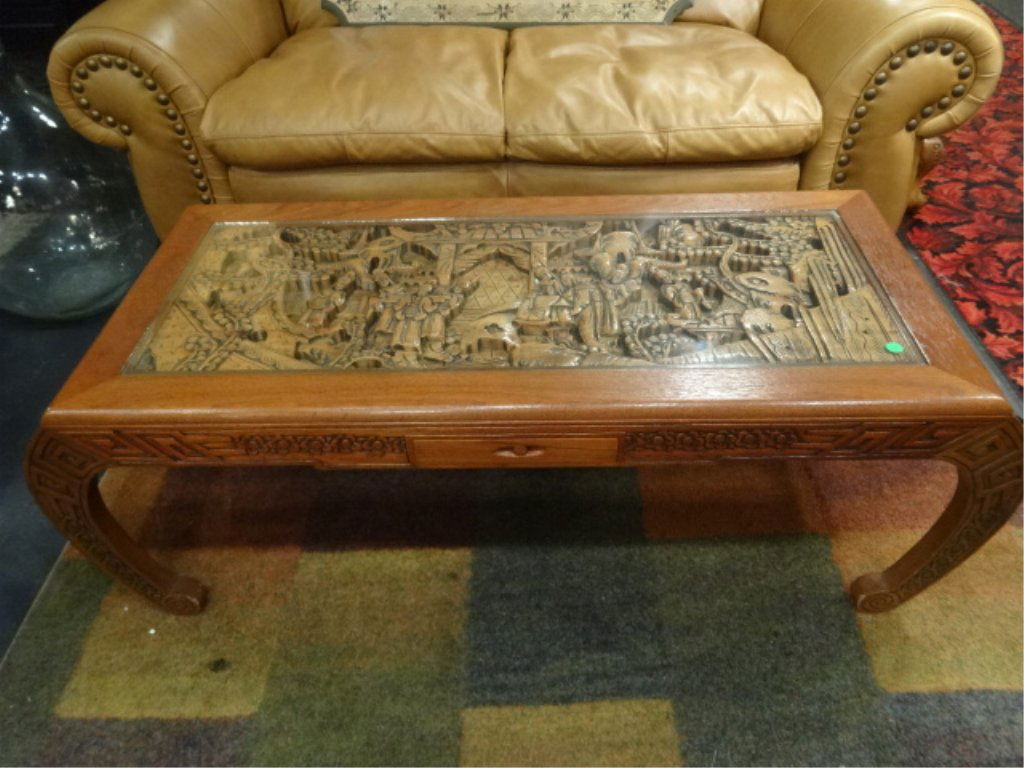 CHINESE CARVED WOOD COFFEE TABLE, CARVED FIGURAL SCENE: CHINESE CARVED WOOD COFFEE TABLE, CARVED FIGURAL SCENE ON TOP, CURVED LEGS, GLASS INSET TOP, SINGLE DRAWER, APPROX 3.5'W, EXCELLENT GENTLY USED CONDITION, SKU429.43