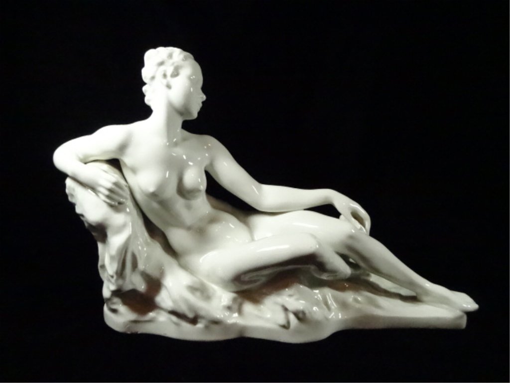 ROSENTHAL GERMANY PORCELAIN RECLINING NUDE WOMAN,: ROSENTHAL GERMANY PORCELAIN RECLINING NUDE WOMAN, MODELLED BY GERMAN SCULPTOR GUSTAV ADOLPH BREDOW IN 1935, MARKED WITH THE GREEN ROSENTHAL GERMANY KUNSTABTEILUNG SELB ON BASE, APPROX 9.5" X 13.5"
