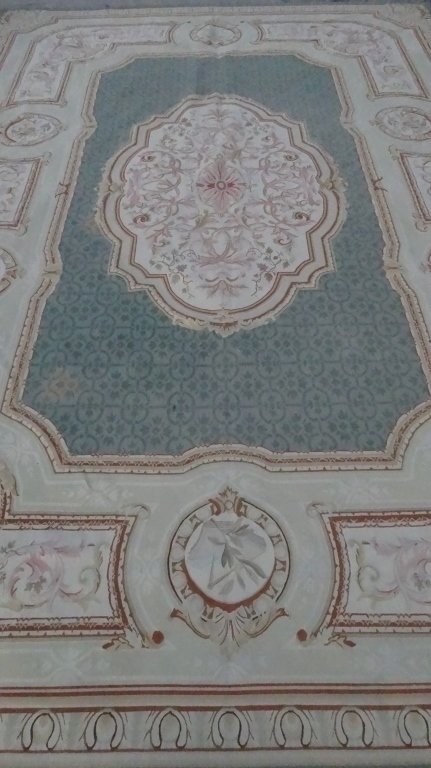 AUBUSSON STYLE RUG, IVORY FIELD WITH FLORAL MEDALLION: AUBUSSON STYLE RUG, IVORY FIELD WITH FLORAL MEDALLION AND GOLD BORDER, VERY GOOD GENTLY USED CONDITION WITH A COUPLE OF LIGHT STAINS, 192" X 127.5", SKU558.05
