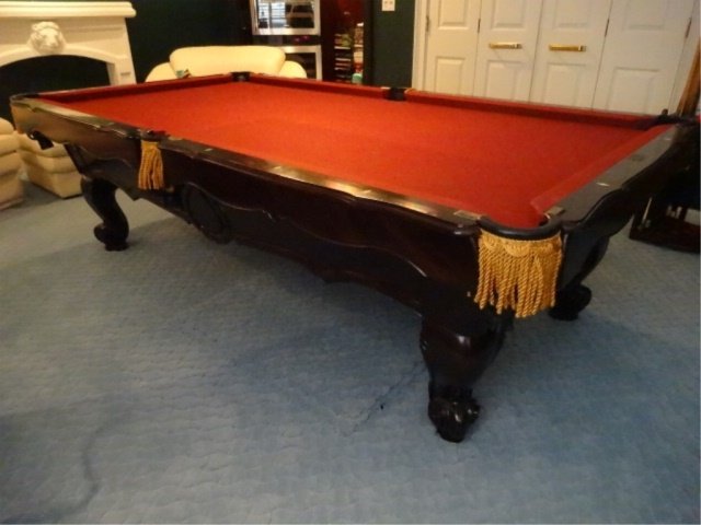 BRUNSWICK BILLIARDS POOL TABLE, DONA MARIE MODEL, DARK: BRUNSWICK BILLIARDS POOL TABLE, DONA MARIE MODEL, DARK FINISH WOOD BASE, GOLD FRINGE, RED FELT UPHOLSTERY, LABELED, VERY GOOD CONDITION WITH 2 SMALL TEARS IN FELT, ***NOTE: THIS ITEM MUST BE PICKED UP