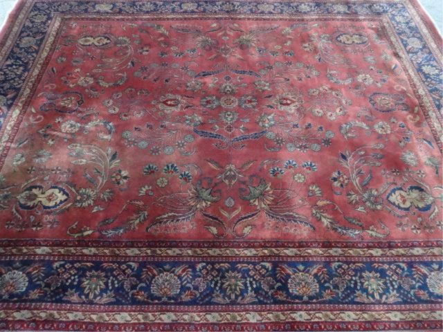 LARGE WOOL PERSIAN STYLE RUG, RED FIELD WITH BLUE AND (1 of 6)