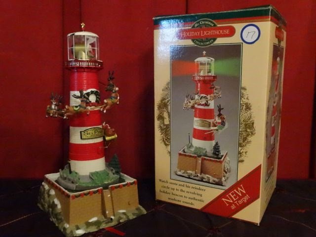 LARGE CHRISTMAS LIGHTHOUSE, SANTA WITH REINDEER,: LARGE CHRISTMAS LIGHTHOUSE, SANTA WITH REINDEER, LIGHTED, PLAYS SEASHORE SOUNDS, IN ORIGINAL BOX, VERY GOOD WORKING CONDITION, APPROX 13.5" X 7". SKU950.12 BX017