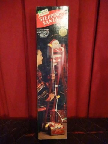 ANIMATED CHRISTMAS SANTA ON LADDER FIGURE, MOVES UP AND: ANIMATED CHRISTMAS SANTA ON LADDER FIGURE, MOVES UP AND DOWN LADDER, WITH MUSIC, IN ORIGINAL BOX, VERY GOOD WORKING CONDITION, APPROX 44" X 10" X 6". SKU950.33 BX070
