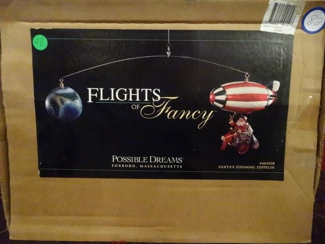 LARGE ANIMATED CHRISTMAS SANTA MOBILE ON ZEPPELIN, IN: LARGE ANIMATED CHRISTMAS SANTA MOBILE ON ZEPPELIN, IN ORIGINAL BOX, VERY GOOD WORKING CONDITION, FIGURE APPROX 29" X 9" X 5". SKU950.38 BX082