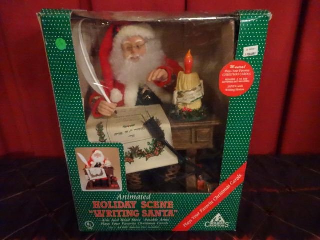 LARGE ANIMATED CHRISTMAS SANTA WITH DESK, IN ORIGINAL: LARGE ANIMATED CHRISTMAS SANTA WITH DESK, IN ORIGINAL BOX, VERY GOOD WORKING CONDITION, APPROX 18" X 12" X 11",. SKU950.33 BX050