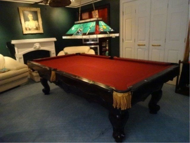 BRUNSWICK BILLIARDS POOL TABLE, DONA MARIE MODEL, DARK: BRUNSWICK BILLIARDS POOL TABLE, DONA MARIE MODEL, DARK FINISH WOOD BASE, GOLD FRINGE, RED FELT UPHOLSTERY, LABELED, VERY GOOD CONDITION WITH 2 SMALL TEARS IN FELT, ***NOTE: THIS ITEM MUST BE PICKED UP