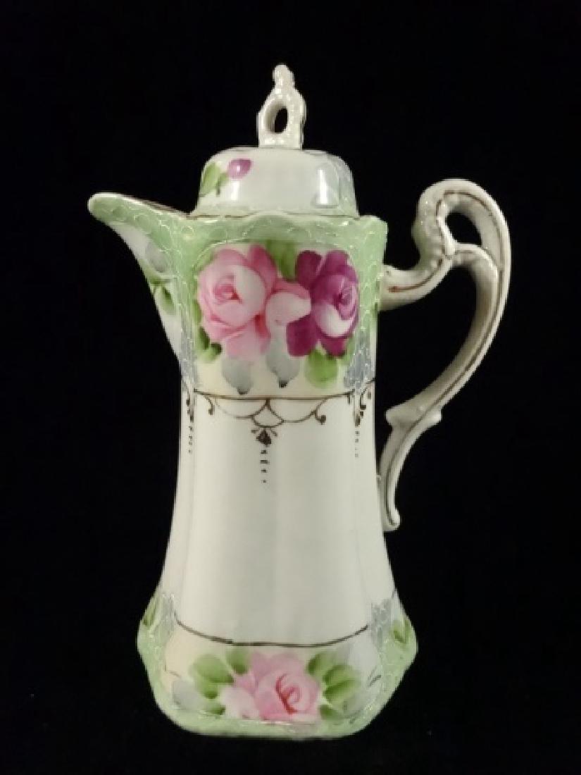 PRE WAR NIPPON PORCELAIN COFFEE POT, HAND PAINTED: PRE WAR NIPPON PORCELAIN COFFEE POT, HAND PAINTED FLORAL DESIGNS, MARKED ON BOTTOM, VERY GOOD CONDITION, 10"H X 7"W, SKU001.26