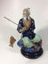 CHINESE MUD MAN FISHERMAN CATCHING A FISH FIGURINE,