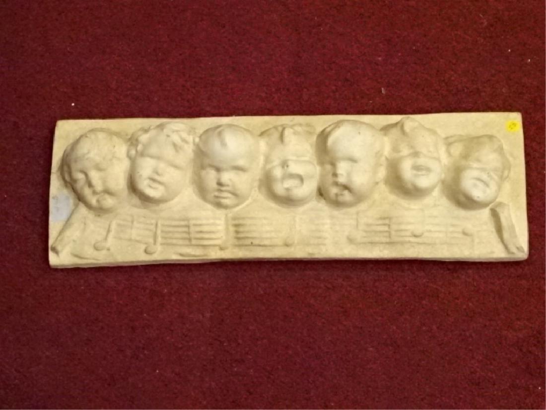 BAS RELIEF PLASTER WALL PLAQUE, CHILDREN'S FACES AND: BAS RELIEF PLASTER WALL PLAQUE, CHILDREN'S FACES AND MUSIC NOTES, VERY GOOD CONDITION, APPROX 24"W, SKU186.34, *** A PORTION OF THE SALE OF THIS ITEM GOES TO SUPPORT THE KIDS OF LOVE CHARITY FOR CHILD