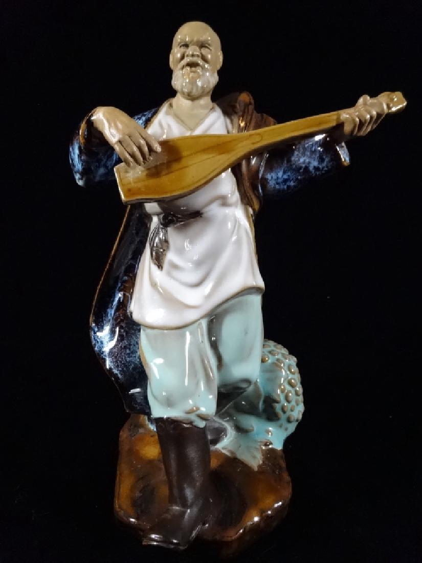 ASIAN PORCELIAN FIGURE, MAN PLAYING MUSICAL INSTRUMENT, (1 of 4)
