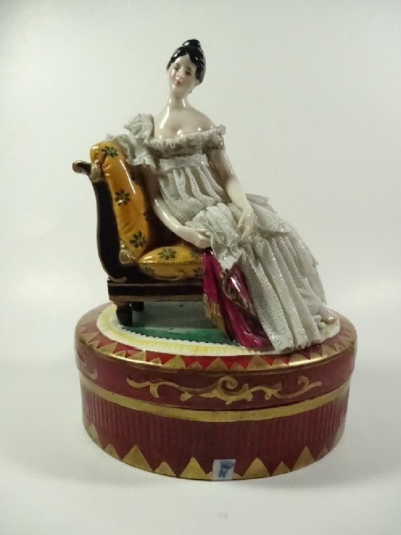 CAPODIMONTE FIGURINE, SEATED LADY WEARING DRESDEN LACE,: CAPODIMONTE FIGURINE, SEATED LADY WEARING DRESDEN LACE, MARKED GERMANY, WITH CAPODIMONTE N MARK, LOSS OF LACE & DAMAGE TO LEFT HAND, APPROX 8.5" X 5.5" X 4.5", SKU205