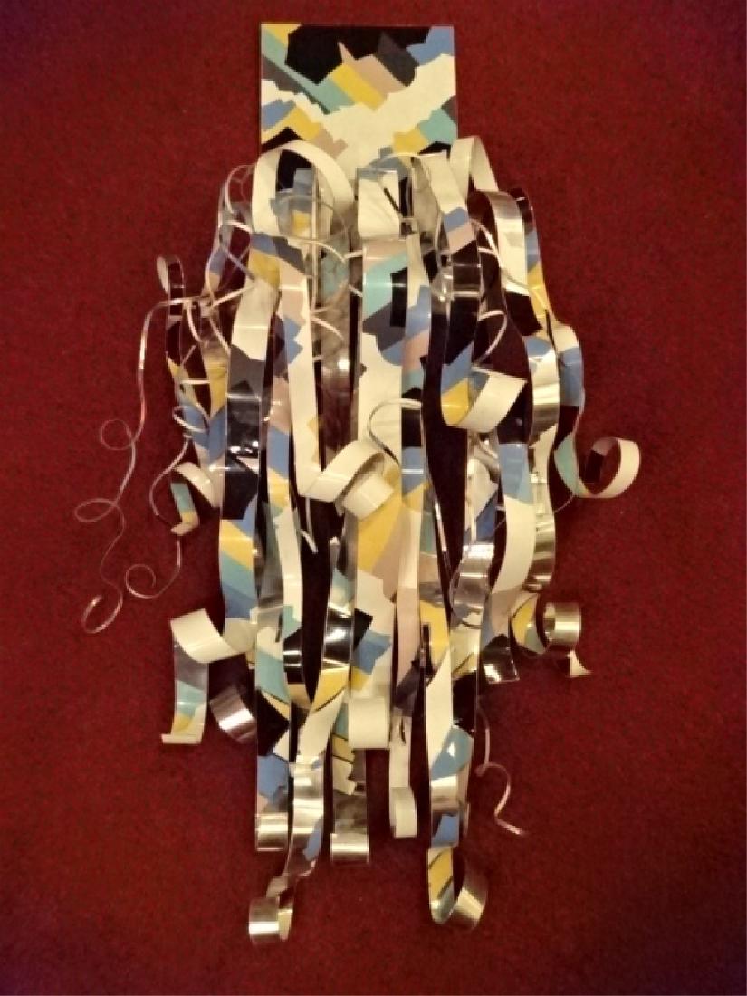 LARGE DOROTHY GILLESPIE METAL RIBBON WALL SCULPTURE,: LARGE DOROTHY GILLESPIE METAL RIBBON WALL SCULPTURE, ENAMEL ON ALUMINUM, TITLED "TWILIGHT MEMORIES", WHITE WITH BLACK, ORANGE, BLUE, SIGNED ON VERSO, 51"H X 26"W X 12"D, SKU226.02