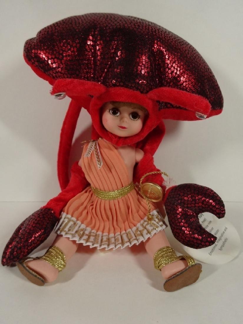 MADAME ALEXANDER MINIATURE "CANCER" DOLL, FROM THE: MADAME ALEXANDER MINIATURE "CANCER" DOLL, FROM THE ZODIAC COLLECTION, BROKEN STRAP ON ONE SANDAL, APPROX 8"H, WITH ORIGINAL BOX
