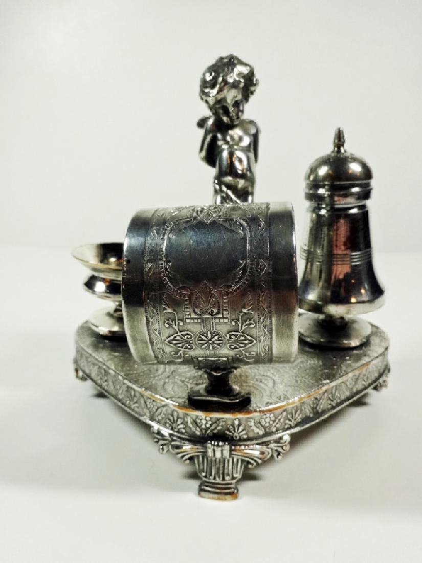 JAMES W. TUFTS FIGURAL NAPKIN RING, CHERUB / CUPID WITH (1 of 6)