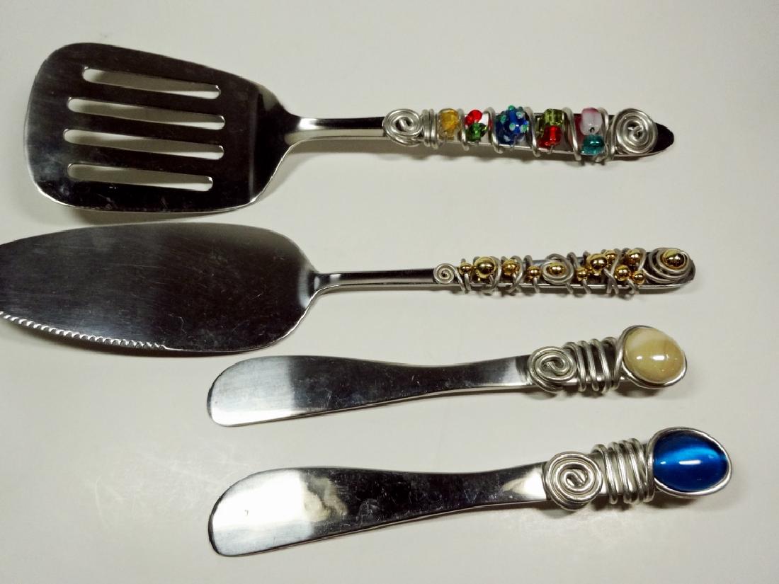 4 PC BEADED SERVING UTENSILS, INCLUDES SPATULA, CAKE: 4 PC BEADED SERVING UTENSILS, INCLUDES SPATULA, CAKE KNIFE, & 2 CHEESE SPREADERS, LARGEST APPROX 10"L