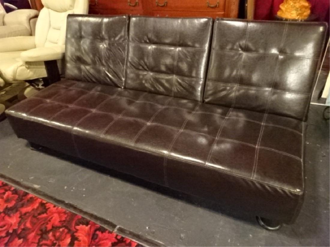 MODERN LEATHER FUTON, CENTER SECTION DROPS DOWN TO SHOW: MODERN LEATHER FUTON, CENTER SECTION DROPS DOWN TO SHOW TABLE AND CUPHOLDERS, FOLDS FLAT, VERY GOOD CONDITION, SKU198.03