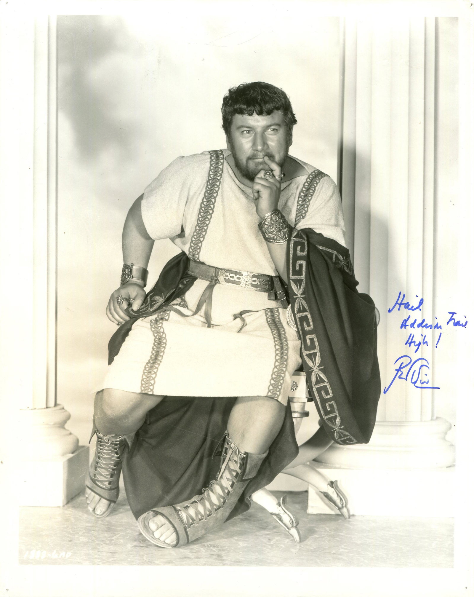 USTINOV PETER: (1921-2004): USTINOV PETER: (1921-2004) British actor, Academy Award winner for Best Supporting Actor in 1960 for his role as Lentulus Batiatus in Spartacus. Signed 8 x 10 photograph of Ustinov seated in a full-le