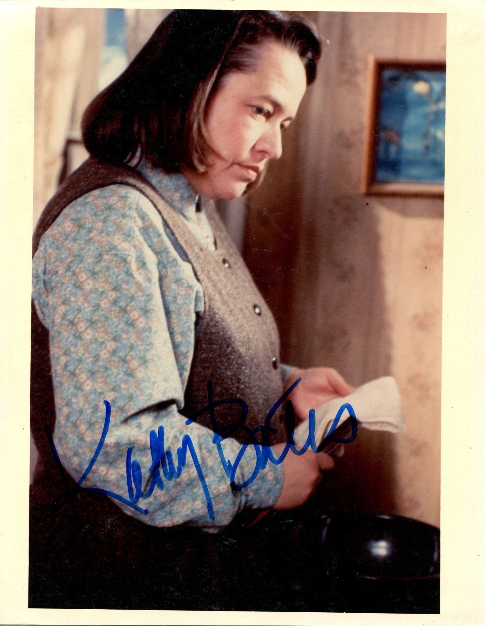 BATES KATHY: (1948- ): BATES KATHY: (1948- ) American actress, Academy Award winner. Signed colour 8 x 10 photograph of Bates standing in a half-length pose in costume from her Oscar winning performance as Annie Wilkes in t