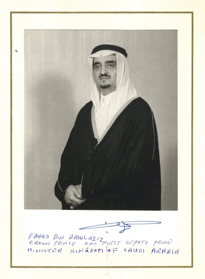 803 FAHD BIN ABDULAZIZ AL SAUD: (1920-2005) King of Sau: 803 FAHD BIN ABDULAZIZ AL SAUD: (1920-2005) King of Saudi Arabia 1982-2005. Vintage signed 5 x 7 photograph of the Crown Prince standing in a half length pose. Signed, in Arabic, in bold blue fountain