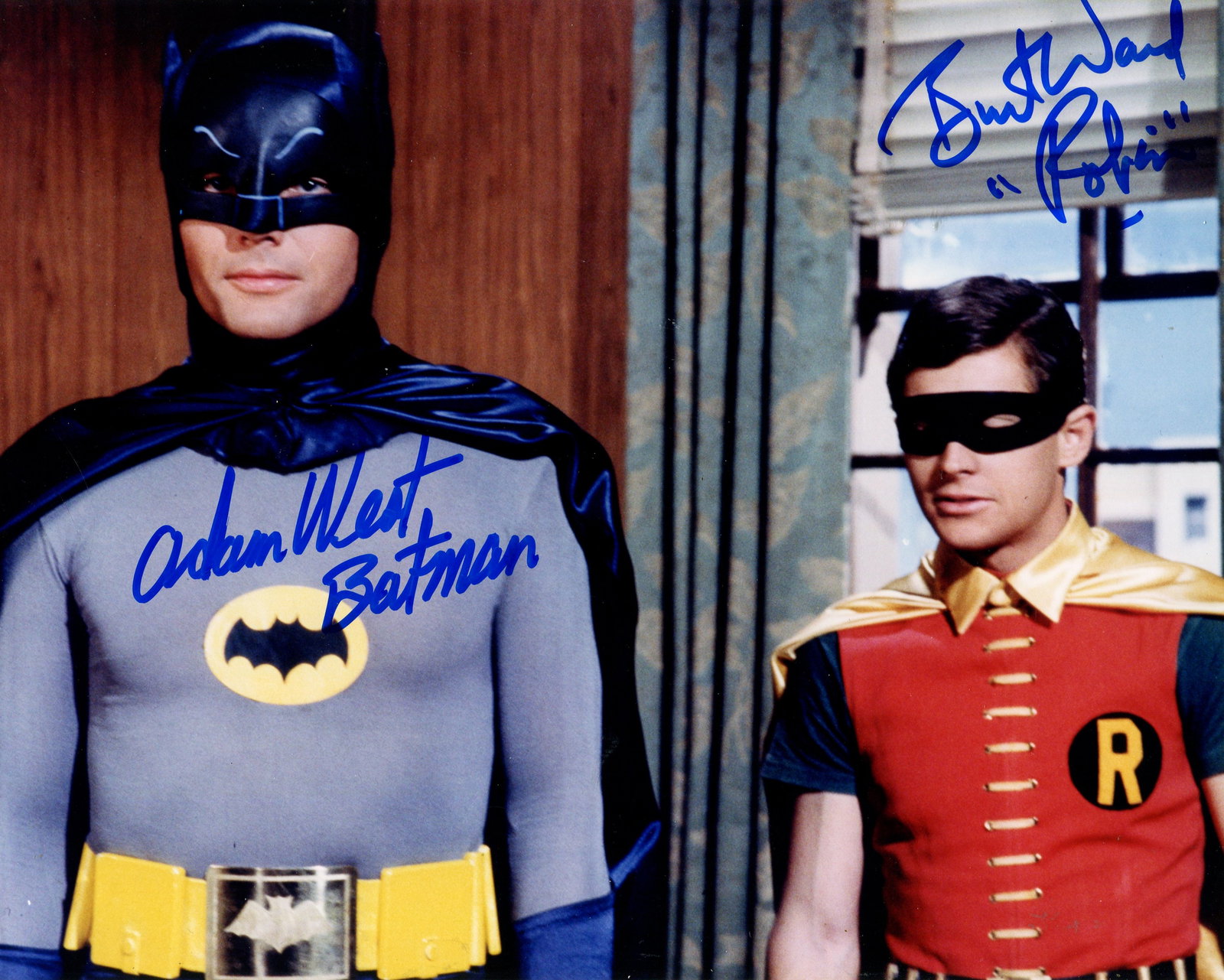 BATMAN:: BATMAN: Signed colour 10 x 8 photograph by both Adam West (Batman) and Burt Ward (Robin) individually, the image depicting the two actors standing together in half length poses in costume as the crime