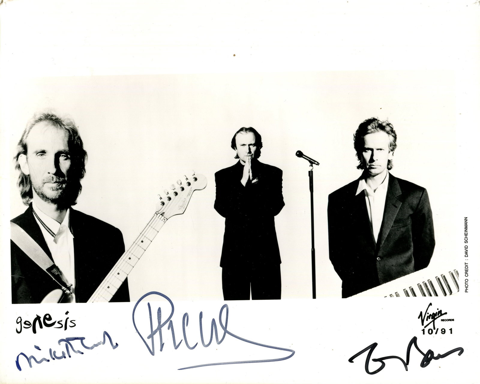GENESIS:: GENESIS: GENESIS: Signed 10 x 8 photograph by all three members of the English rock band Genesis individually, comprising Phil Collins, Mike Rutherford and Tony Banks, the promotional Virgin Records i