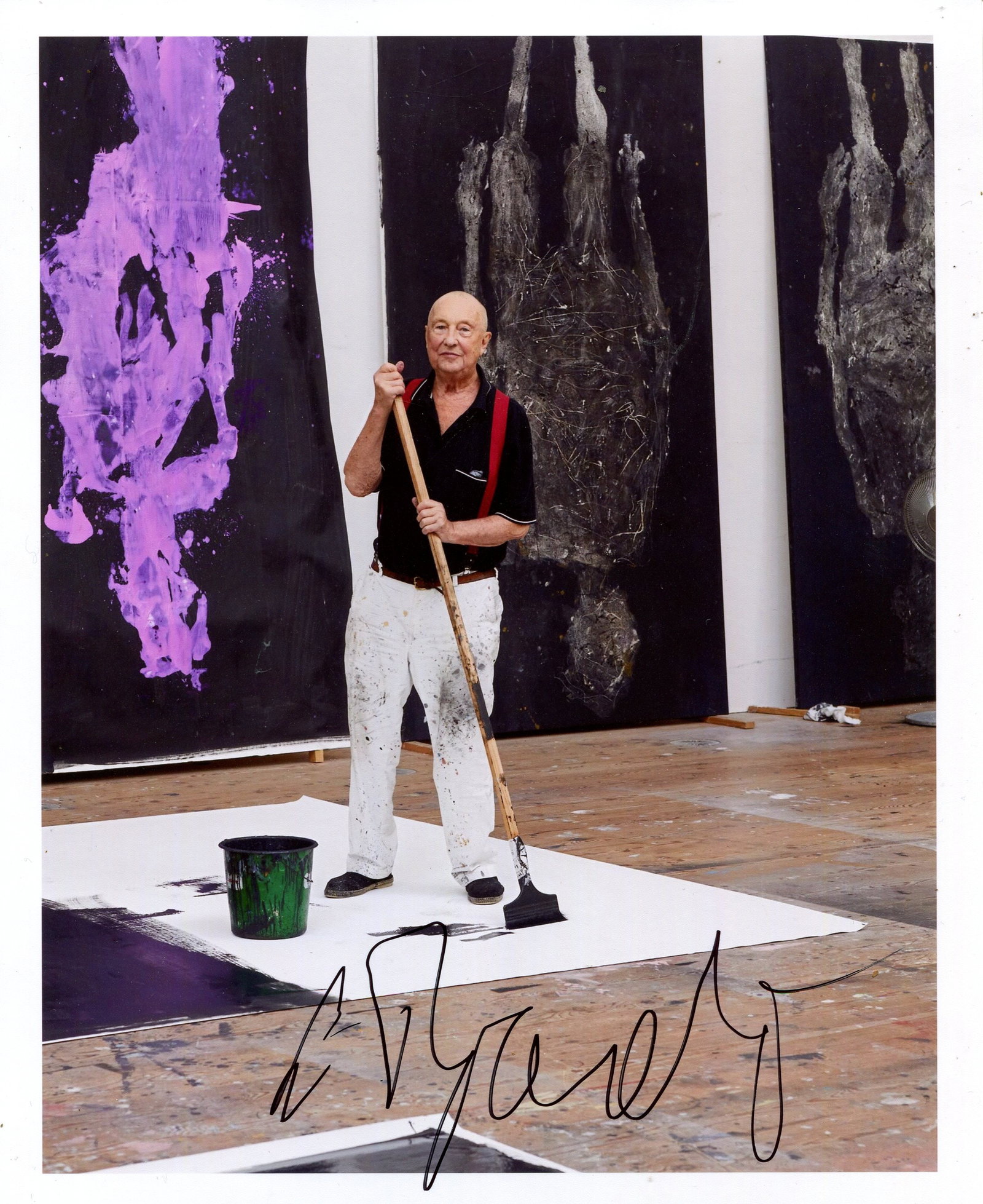 BASELITZ GEORG: (1938- ): BASELITZ GEORG: (1938- ) BASELITZ GEORG: (1938- ) German painter, sculptor and graphic artist. Signed colour 8 x 10 photograph of Baselitz standing in a full-length pose as he works on a large canvas