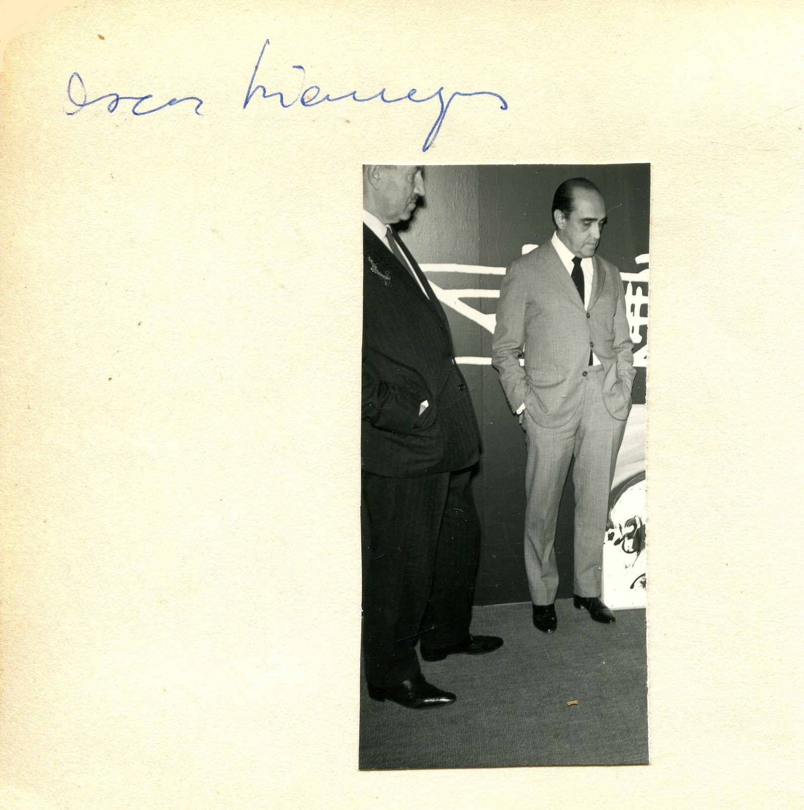 NIEMEYER OSCAR: (1907-2012): NIEMEYER OSCAR: (1907-2012) Brazilian architect. Blue ink signature (´Oscar Niemeyer´) on a 12mo piece (11 x 11 cm) with a small photograph of Niemeyer standing in a full length pose alongside anoth