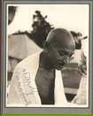 GANDHI MAHATMA: (1869-1948) A wonderful signed photograph of Gandhi, captured on his birthday in