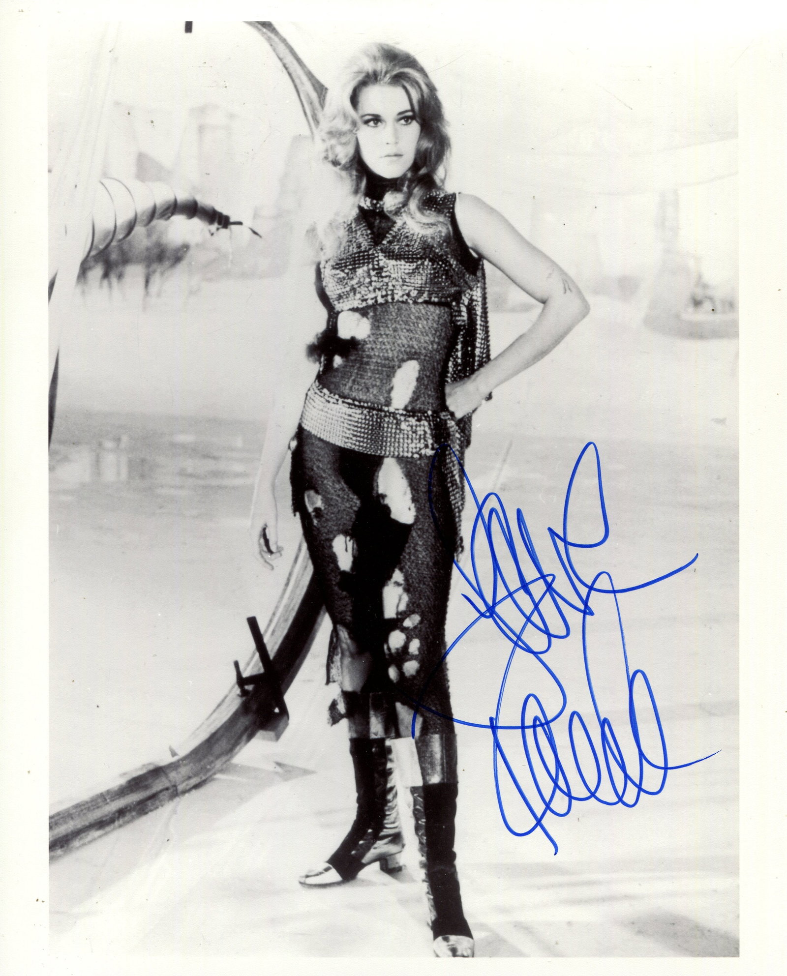 FONDA JANE: (1937- ): FONDA JANE: (1937- ) American actress, Academy Award winner. Signed 8 x 10 photograph of Fonda standing in a full-length pose in costume from one of her most famous roles as the space adventurer Barba