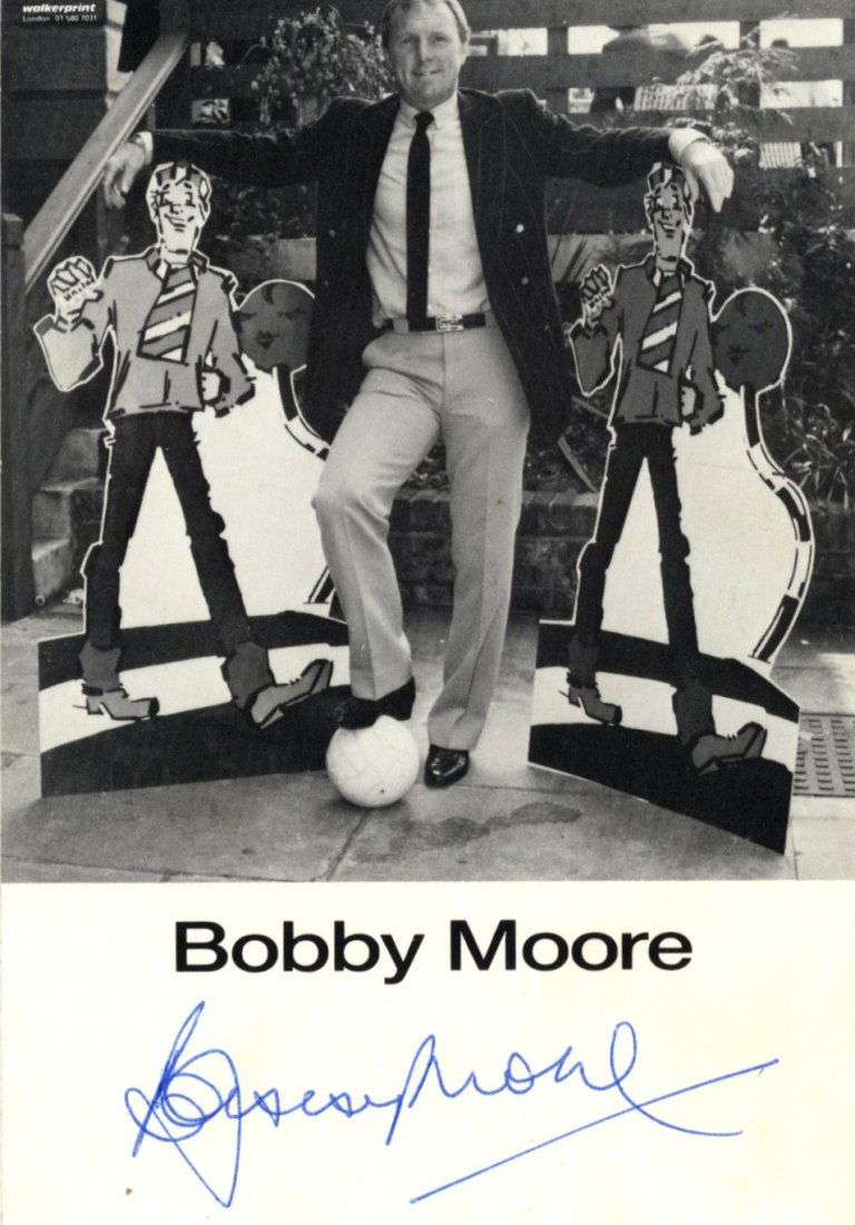 MOORE BOBBY: (1941-1993) English Footballer, Captain of: MOORE BOBBY: (1941-1993) English Footballer, Captain of the England World Cup winning team, 1966. Signed 4 x 6 photograph of Moore standing in a full length pose with a football at his feet. Signed wi