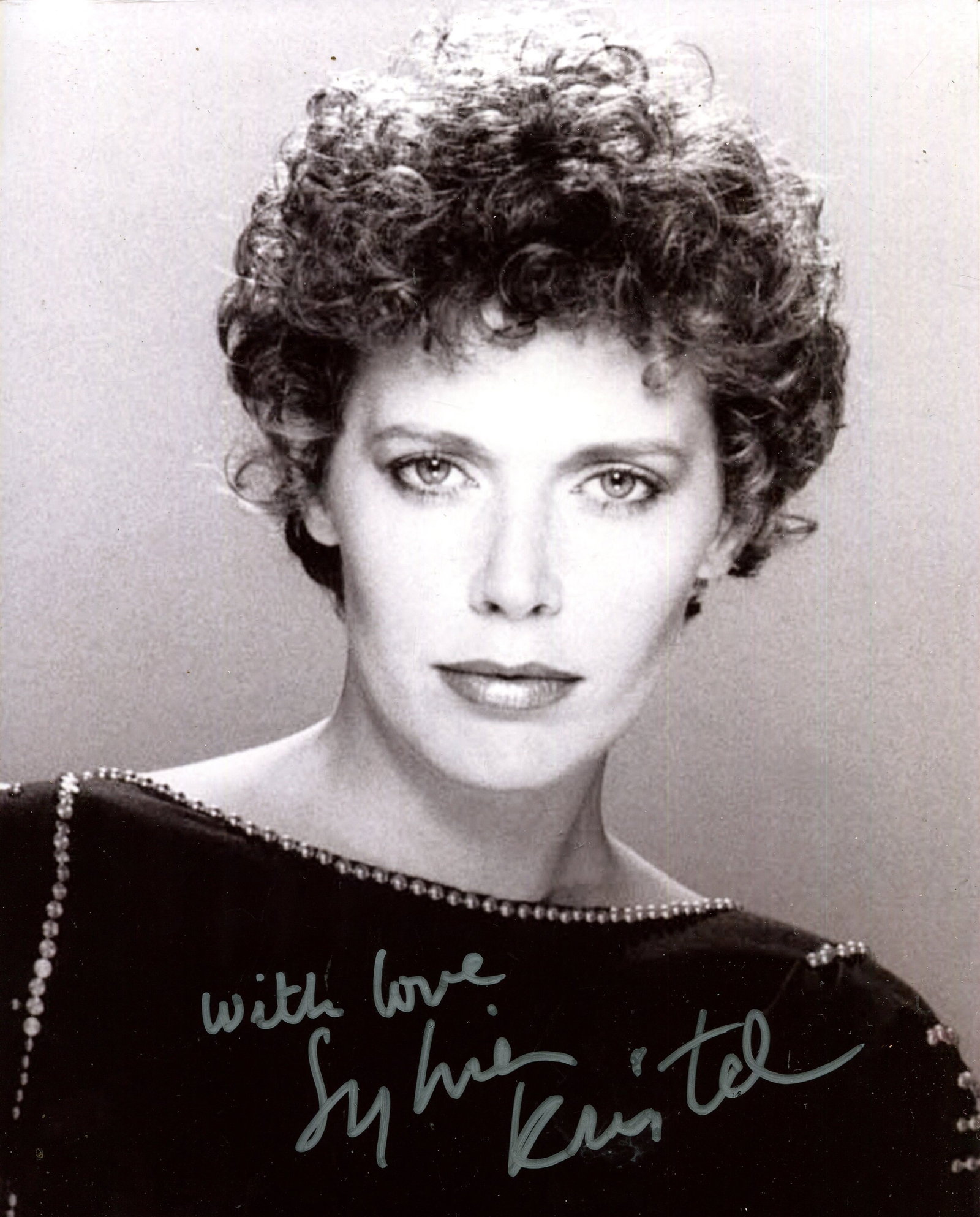 KRISTEL SYLVIA: (1952-2012): KRISTEL SYLVIA: (1952-2012) Dutch actress and model, famous for her performance in the title role of the French erotic drama film Emmanuelle (1974). Signed 8 x 10 photograph of Kristel in a head and s