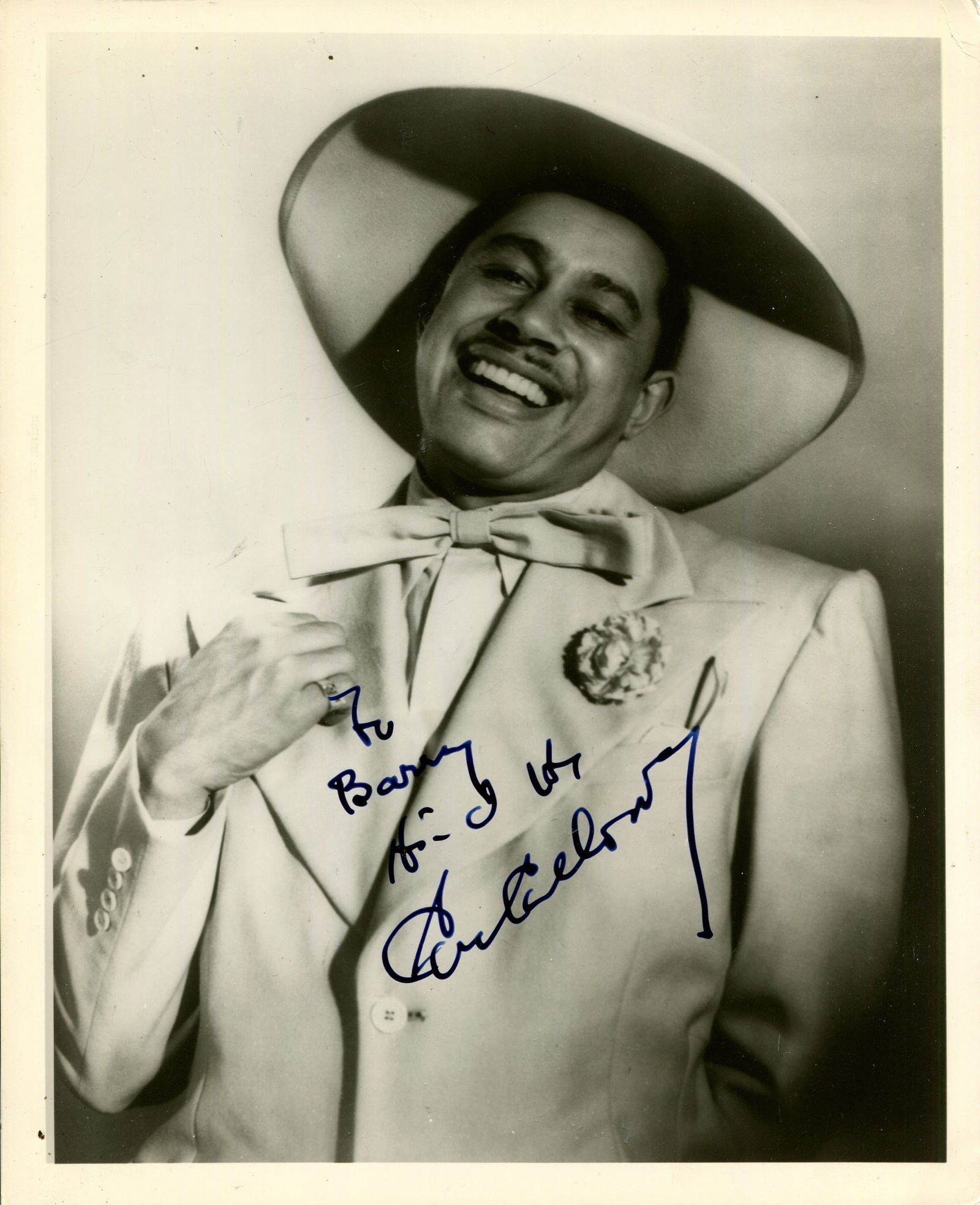MUSIC: (x3): MUSIC: Cab Calloway (1907-1994) American jazz singer and bandleader. A good signed and inscribed 8 x 10 photograph of Calloway standing in a half-length pose. Signed in bold, dark blue fountain pen in