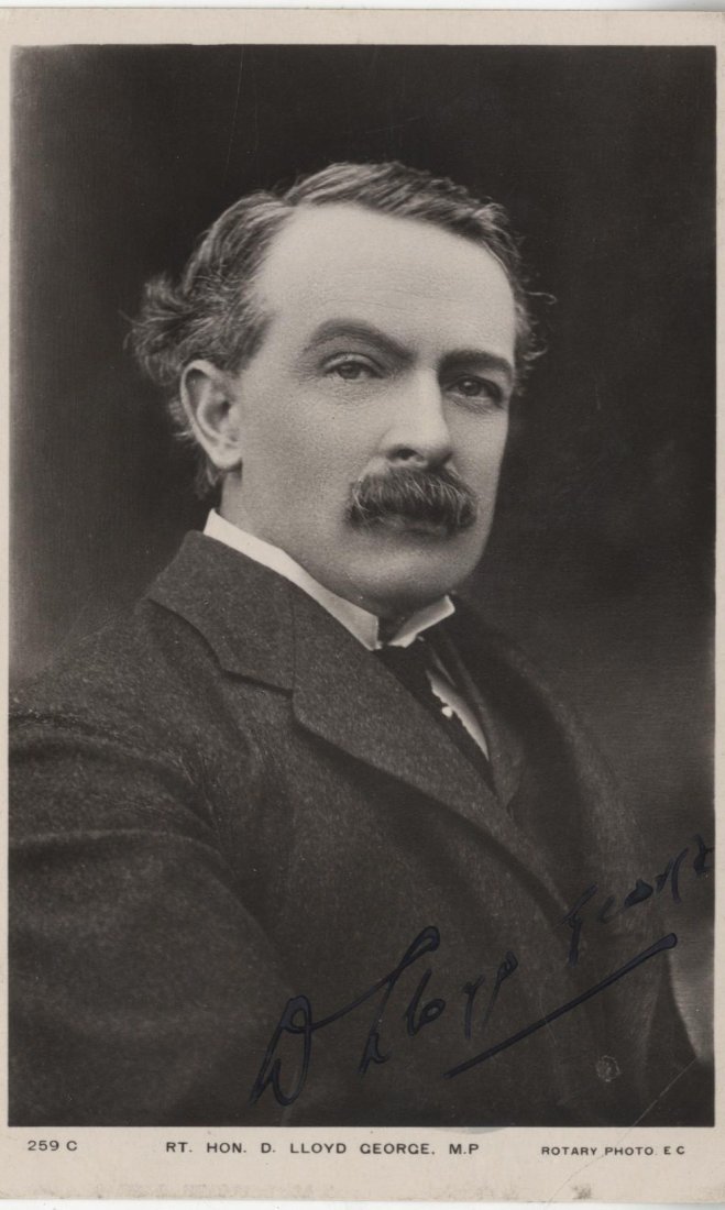 LLOYD GEORGE DAVID: (1863-1945) British Prime Minister: LLOYD GEORGE DAVID: (1863-1945) British Prime Minister 1916-22. A vintage signed postcard photograph of Lloyd George in a head and shoulders pose. Signed in black fountain pen ink to a light area at t