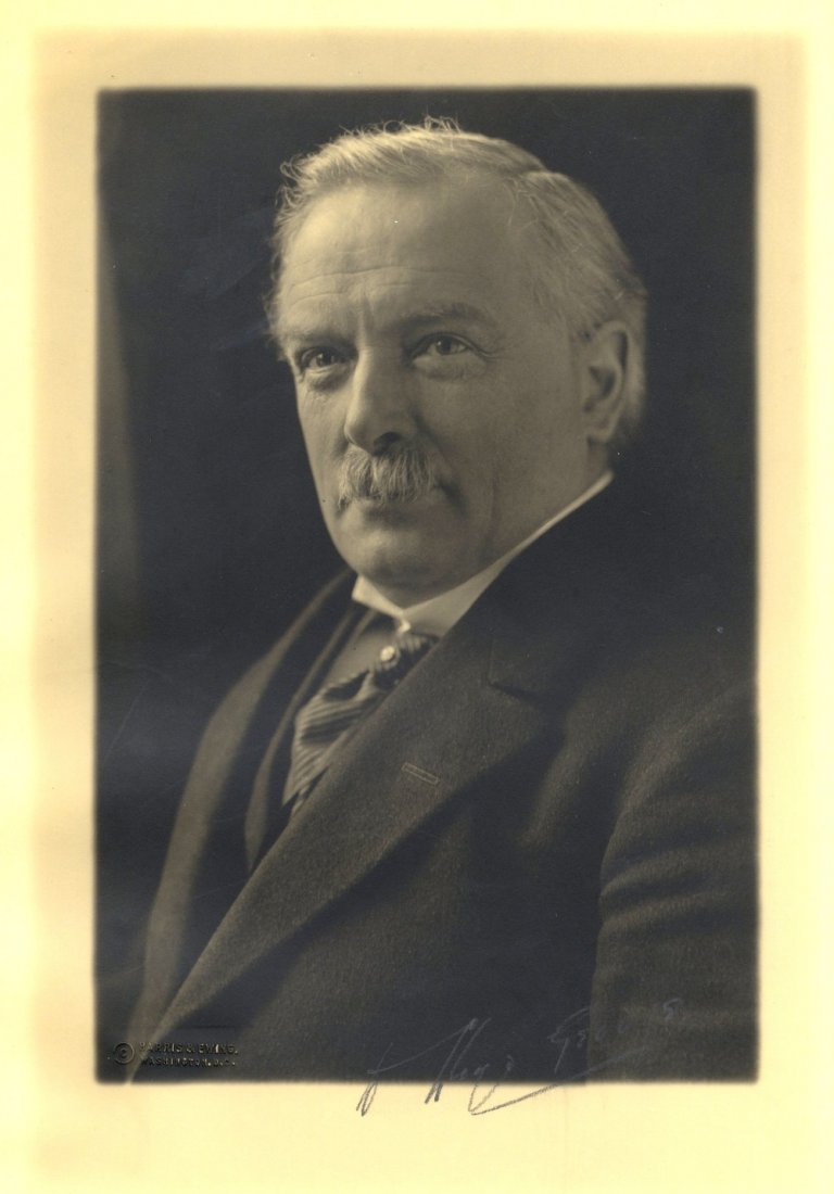 LLOYD GEORGE DAVID: (1863-1945) British Prime Minister: LLOYD GEORGE DAVID: (1863-1945) British Prime Minister 1916-22. Vintage signed sepia 9.5 x 14 photograph of Lloyd George in a formal head and shoulders pose. Photograph by Harris & Ewing of Washington