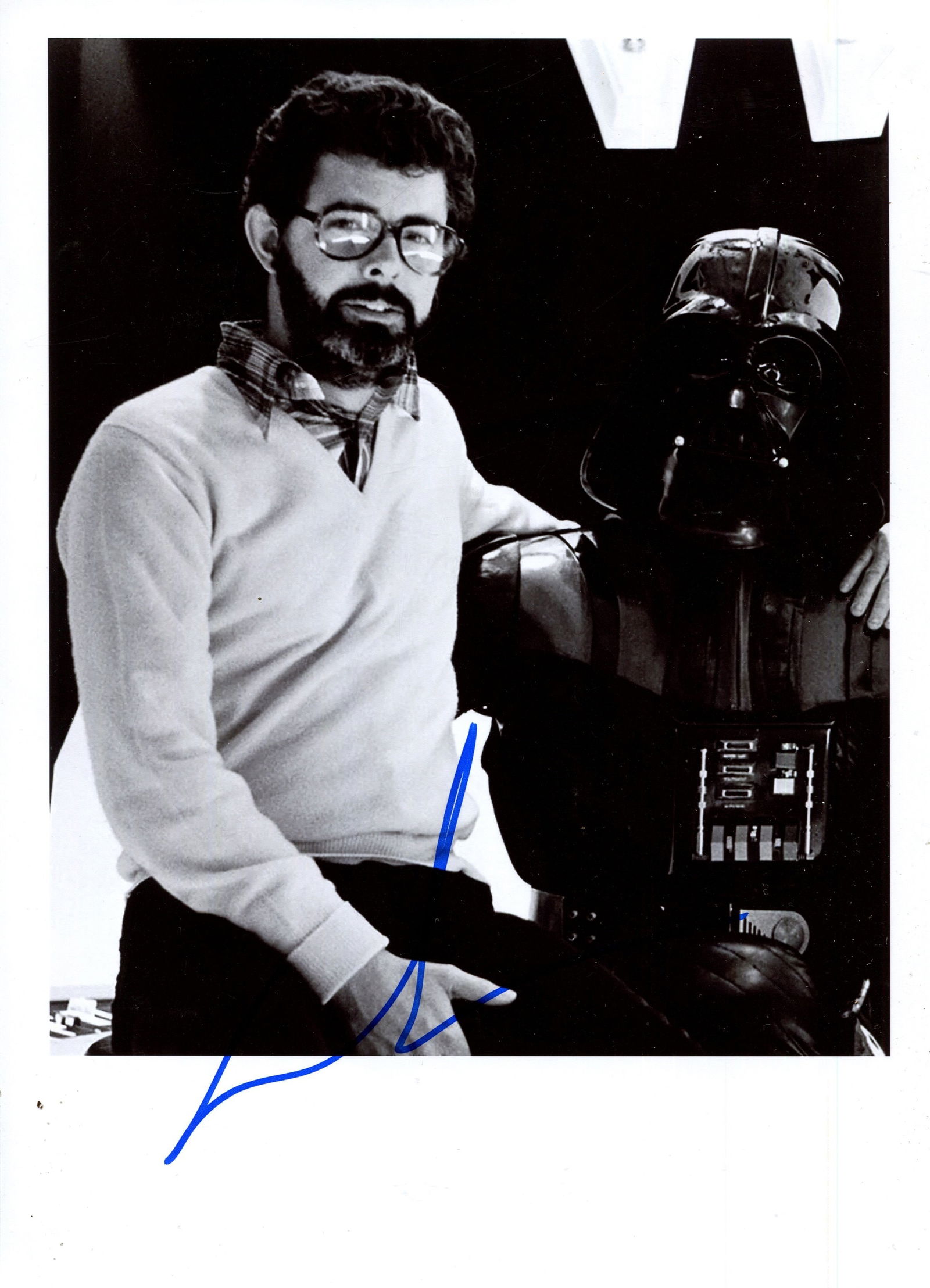 LUCAS GEORGE: (1944- ): LUCAS GEORGE: (1944- ) American film Director, an Academy Award nominee. Signed 8 x 11 photograph by Lucas, the image depicting him standing in a half-length pose alongside Darth Vader during the film